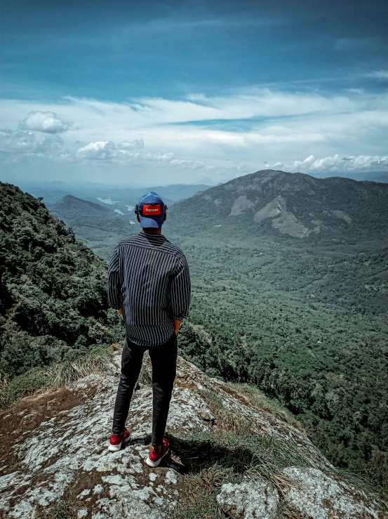 a man standing on top of a rocky mountain