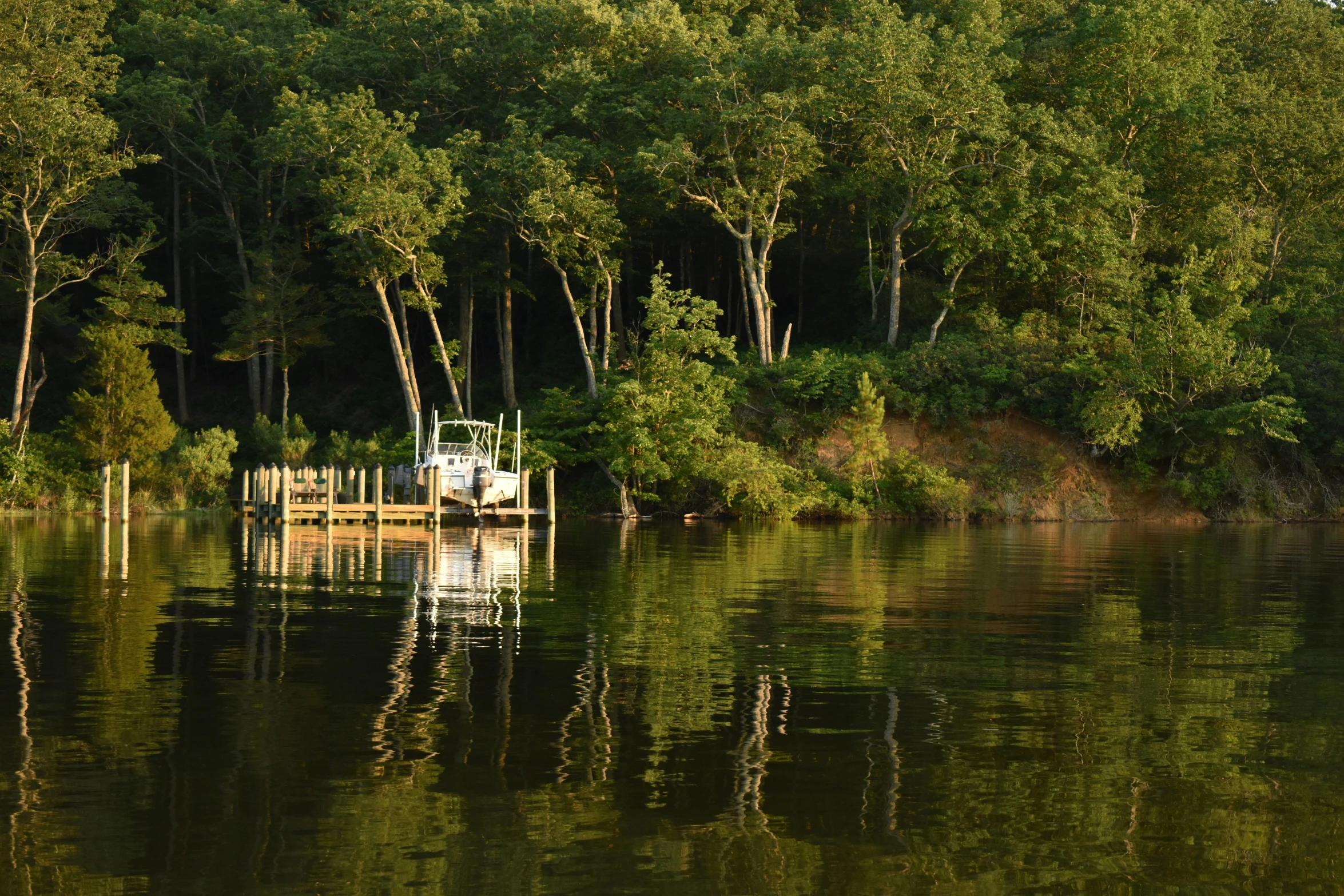 a truck on top of a dock in a lake