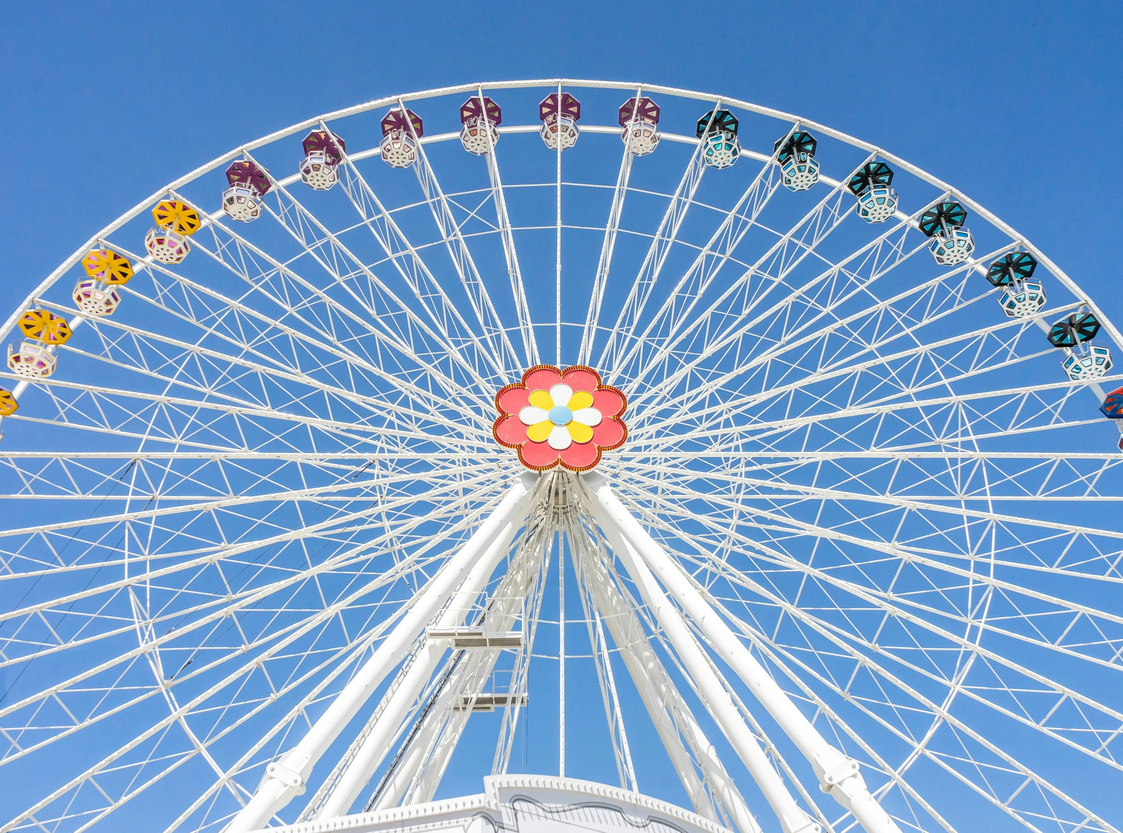 the big wheel in front of blue sky