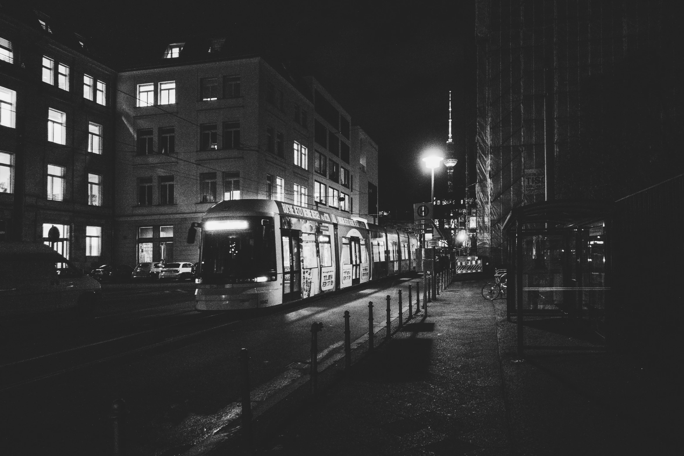 a train on tracks in an empty street