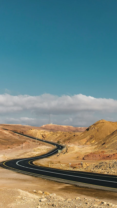 the road goes in the direction of the mountains