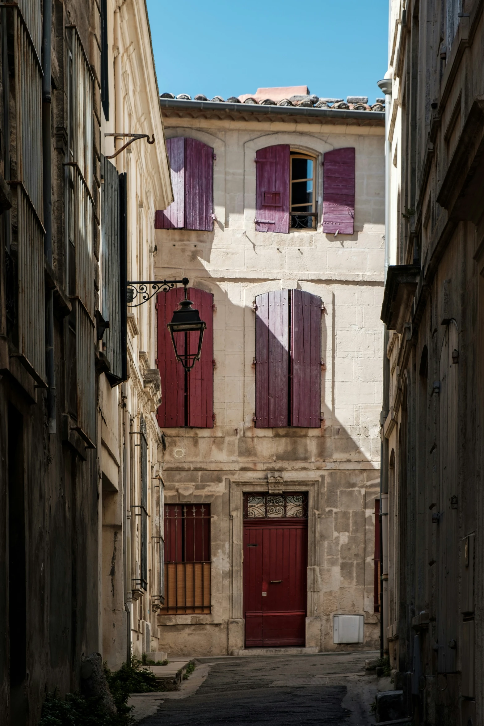 a cobbled street with lots of stone buildings