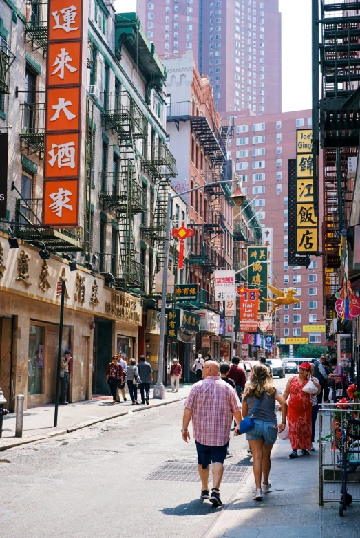 a street in a foreign country where people walk by and people talk