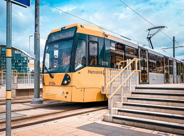 a transit bus waits at a bus stop