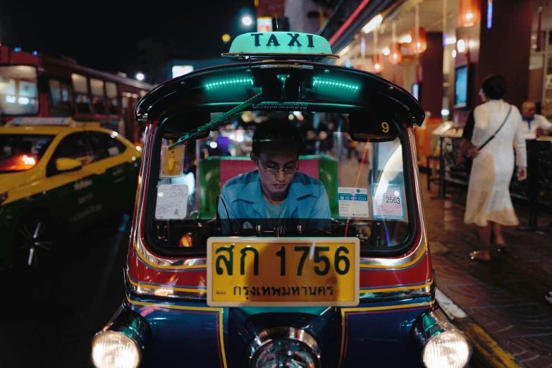 an image of taxi with a man sitting in a back