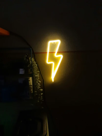 a neon sign with a bright light on it's side