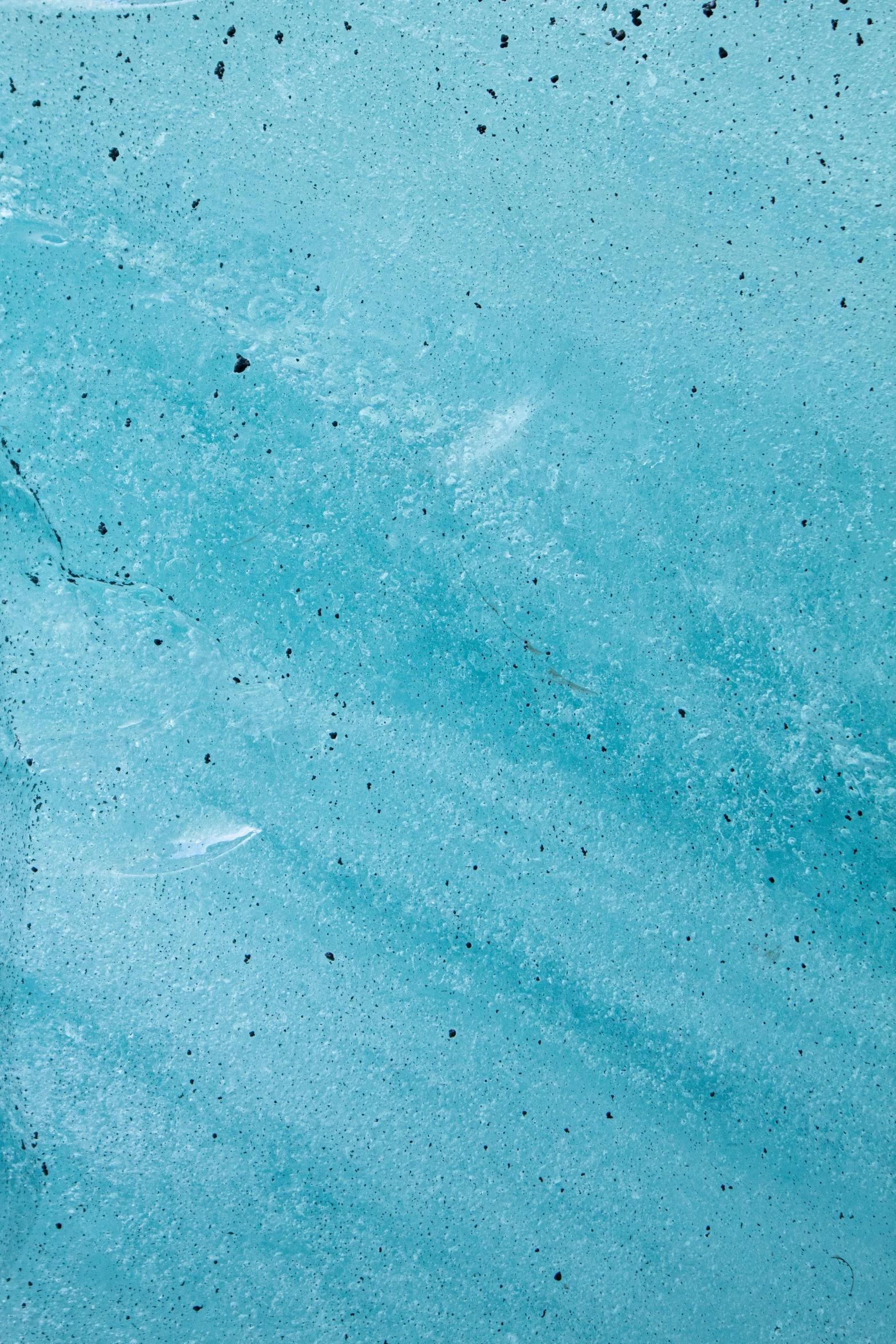 the bottom view of an icy frozen blue river