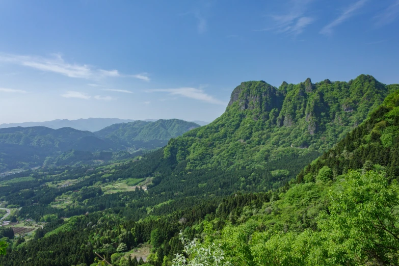 the mountains are very green and mountainous in size