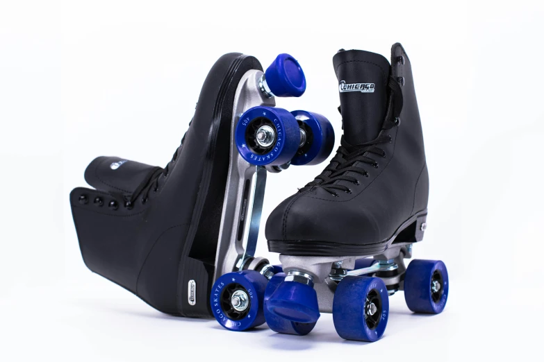 a pair of roller blades, and skates sit side by side