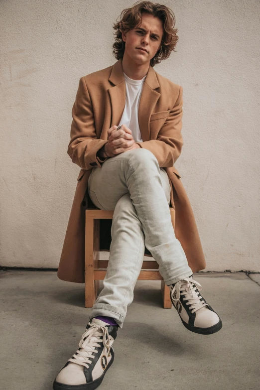 an image of a man that is sitting on a chair