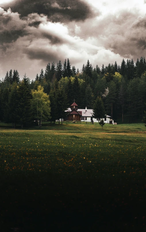 a rural house in the middle of a field