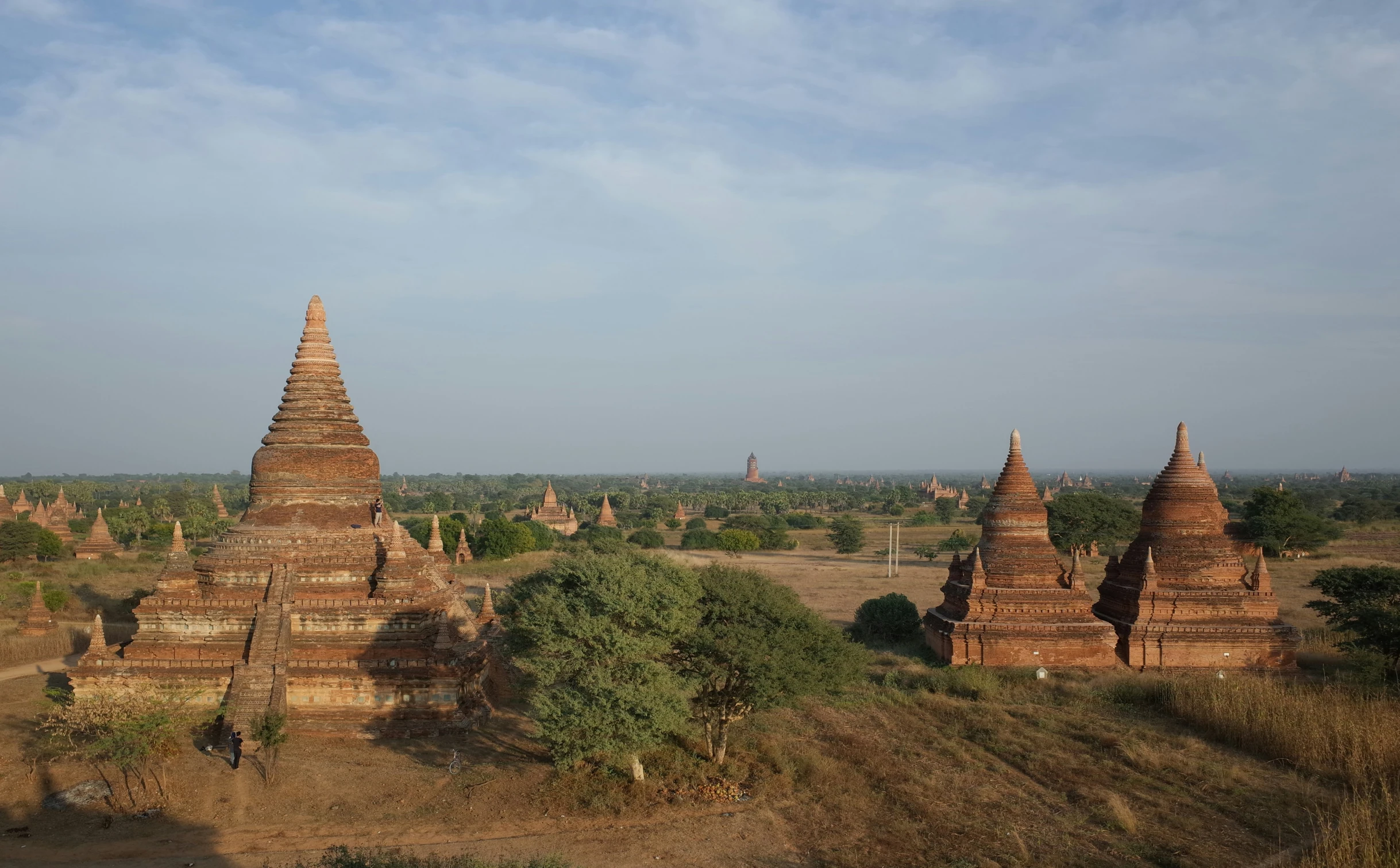 a group of old temples in an arid area