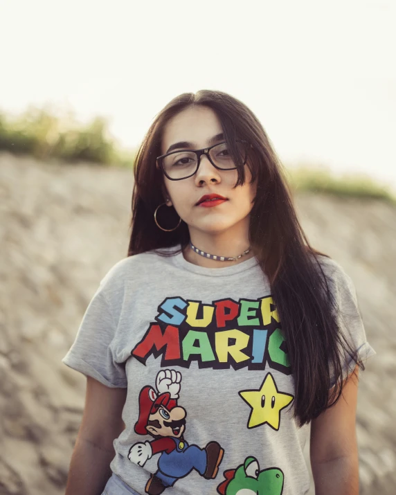 a girl is posing for a po while wearing an athletic shirt