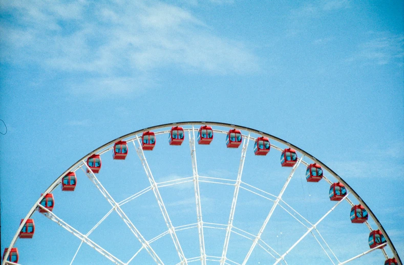 an image of a ferris wheel with different rides