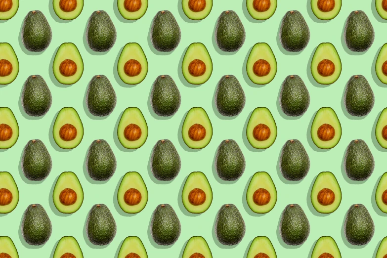 a wall with a pattern of cut avocados