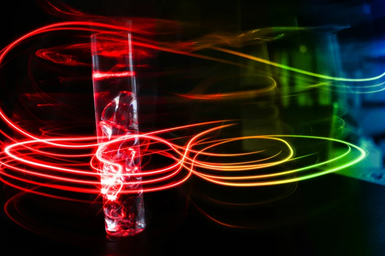 a blurry pograph of a clear tube with colorful lights