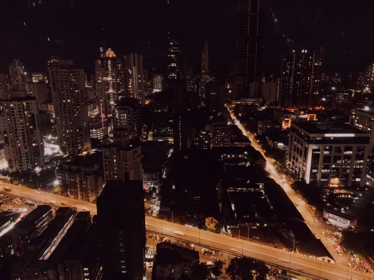 city lights are shown along a crowded street