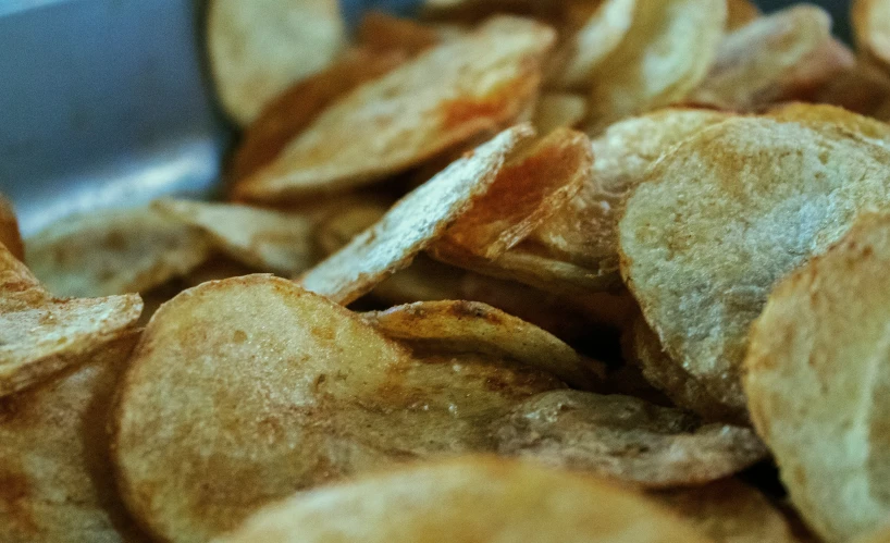 an old potato chips with a bite taken out of the middle