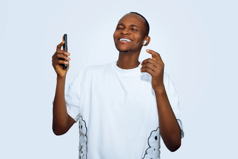 a black man holding up a smart phone