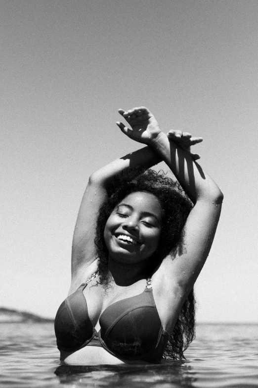 a black and white po of a young lady holding a bird