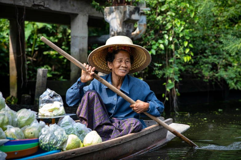 a woman sitting in a boat with an open raft