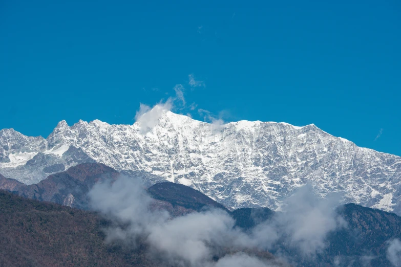 a mountain is covered in snow during the winter