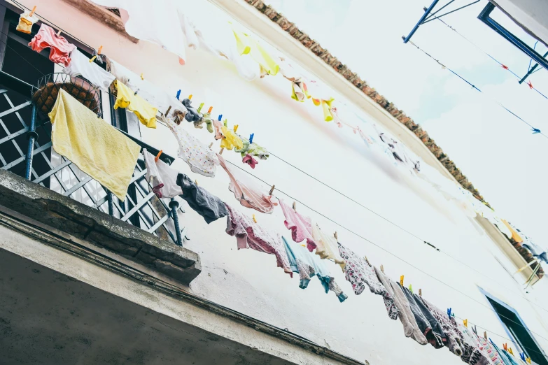 colorful towels hang in the air on a line