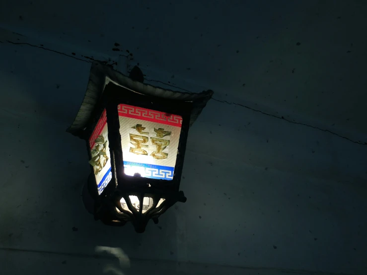 a street light is shown at night in the dark