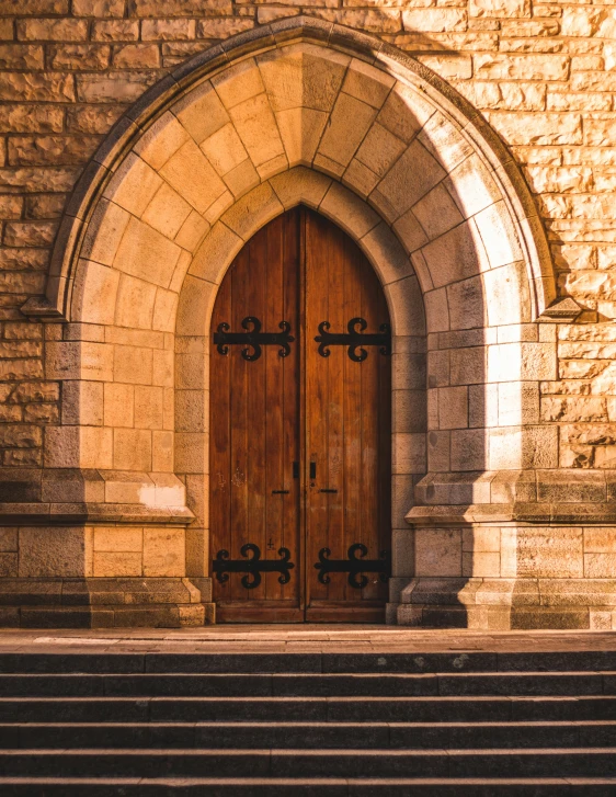 two wooden doors with windows on one side and another one on the other