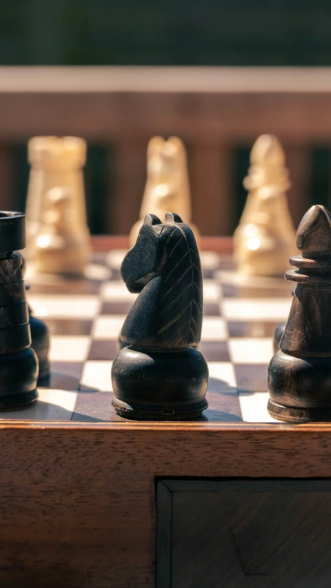 a chess board that has a couple of small pieces sitting on it