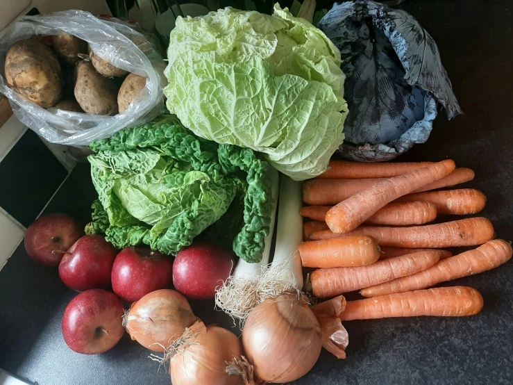 an array of vegetables are piled neatly on top of each other