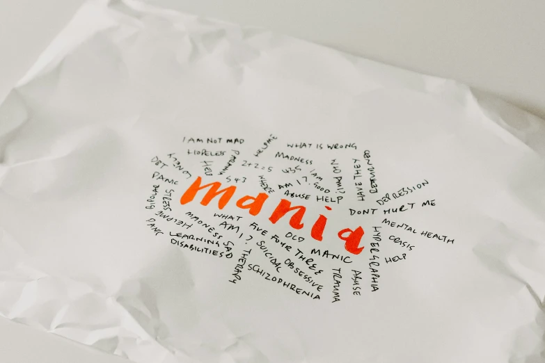 a piece of paper with words written in orange