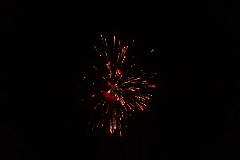 a dark night time with a colorful firework