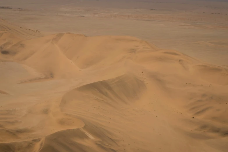 the landscape is covered in many sand dunes
