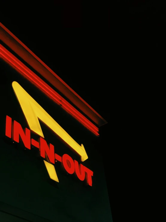 the front of a neon sign that reads inn - n - out