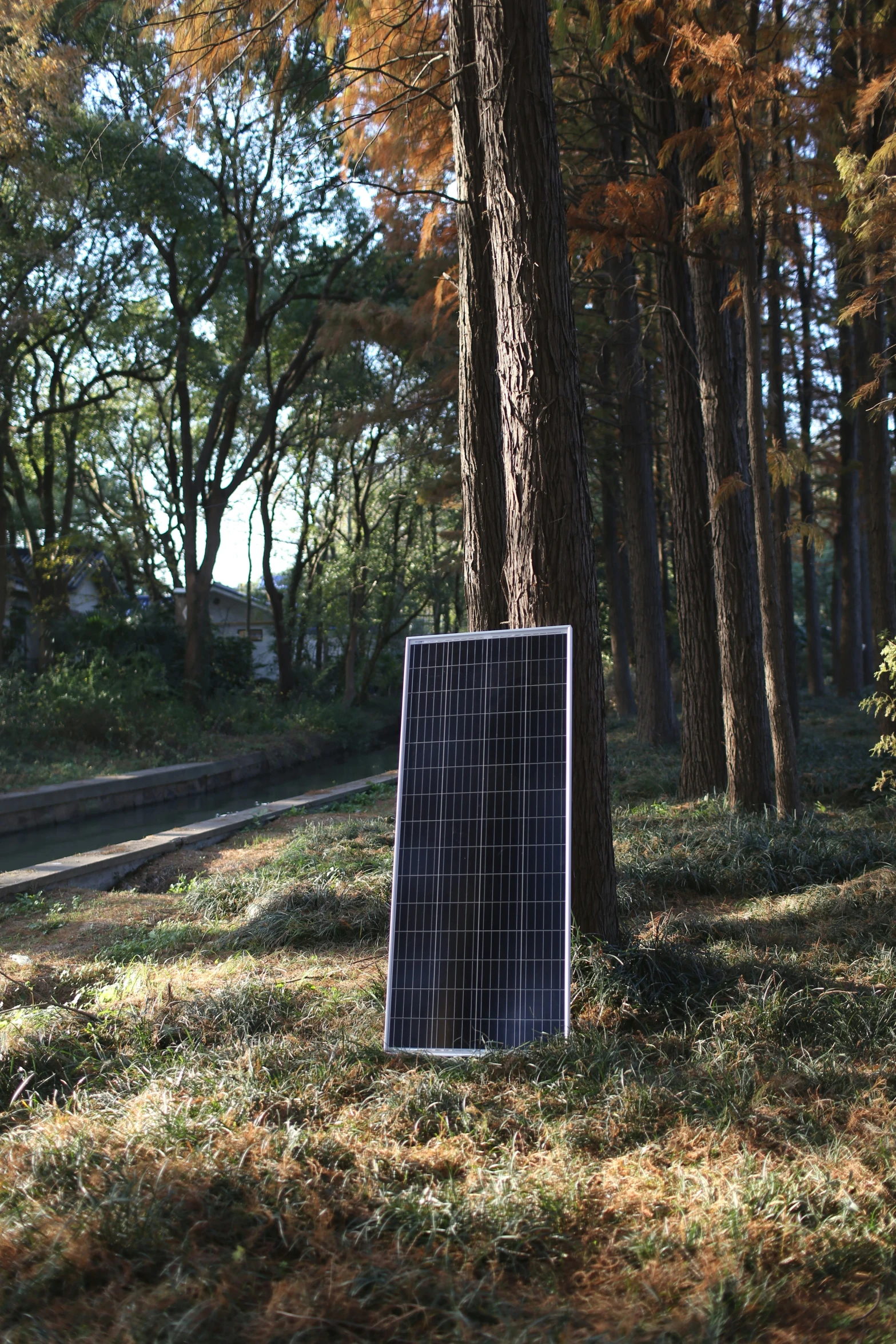 a black and white picture of a solar panel on the ground