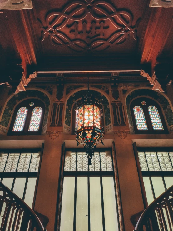 an ornately decorated and stained glass window in a building