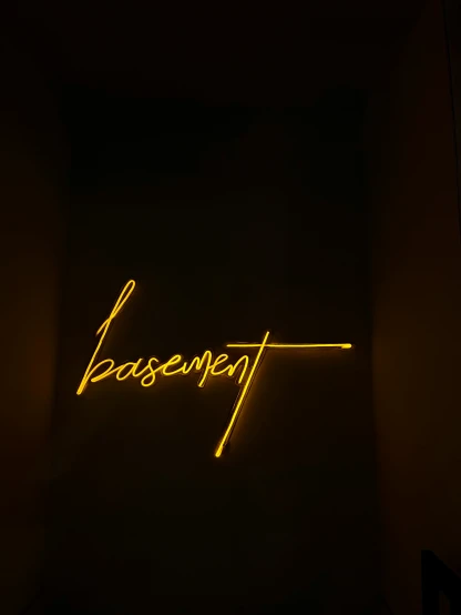 the word essenetit is lit up on a wall