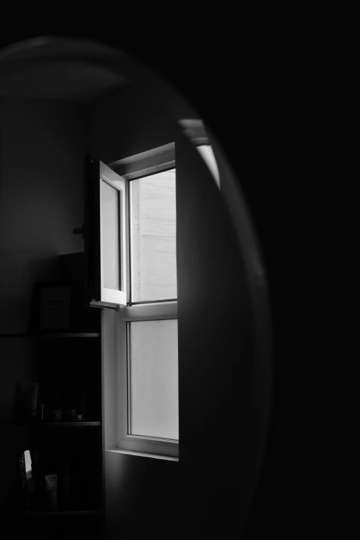 a close up of an open window in a building