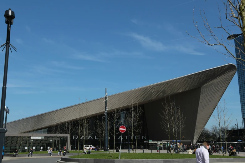 the tall building has a triangular roof over it