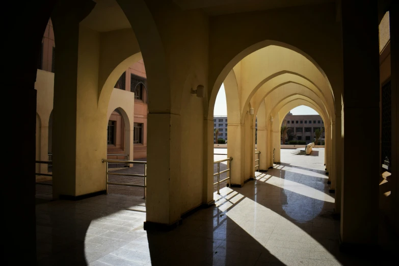 an arch is set high up with the sun shining on it