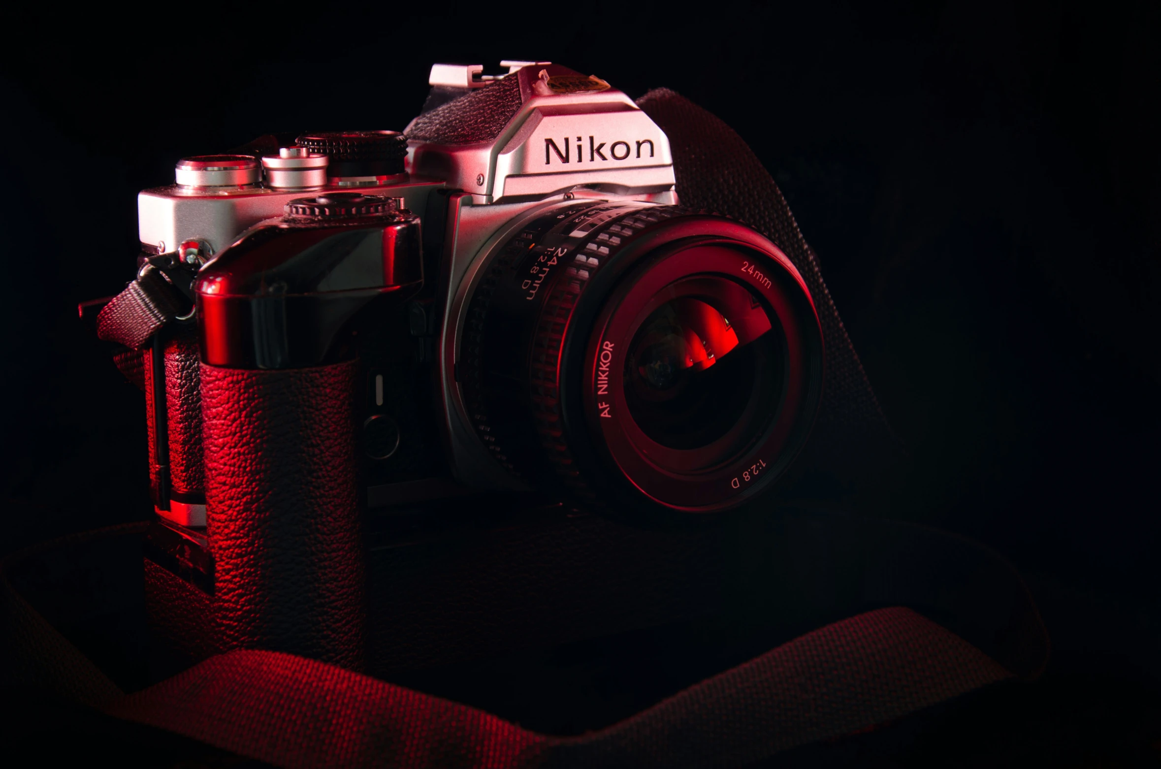 the nikon is being displayed in the dark