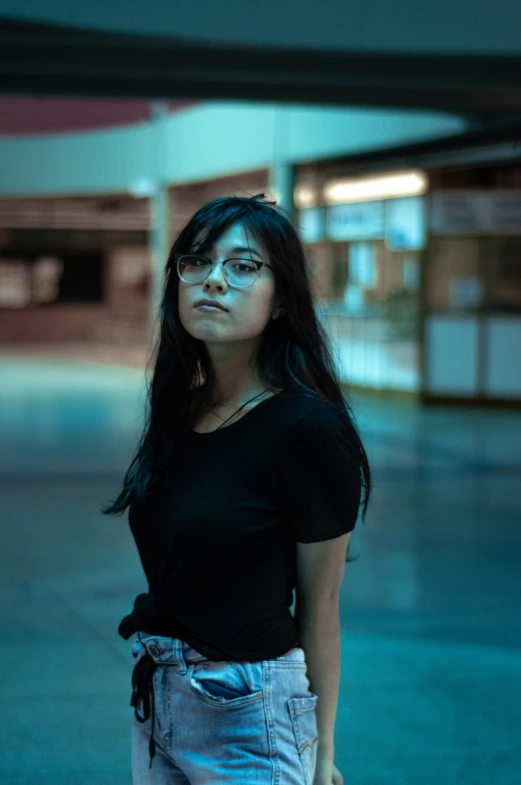 girl in black shirt standing in parking garage