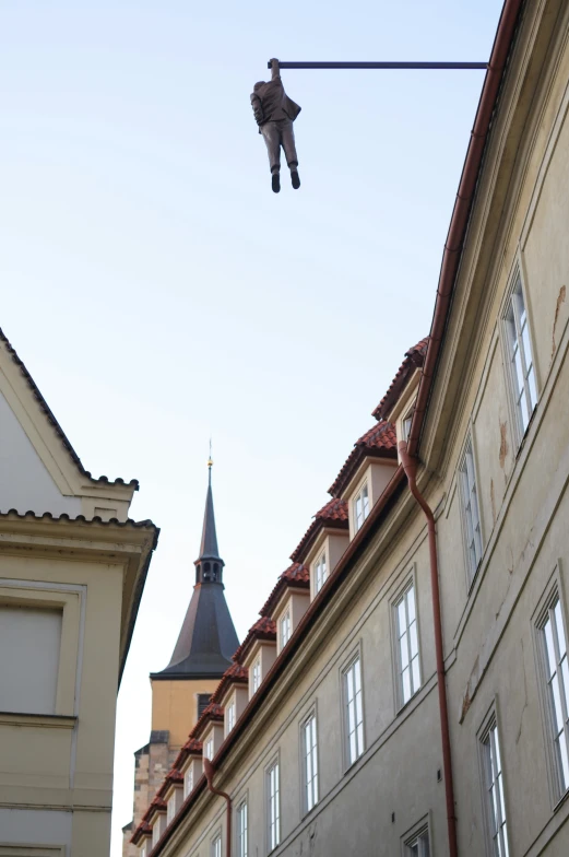 a bird flying over the tops of buildings in an urban area