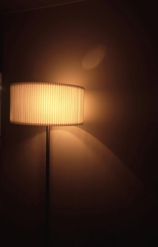 a white lamp in a dark room