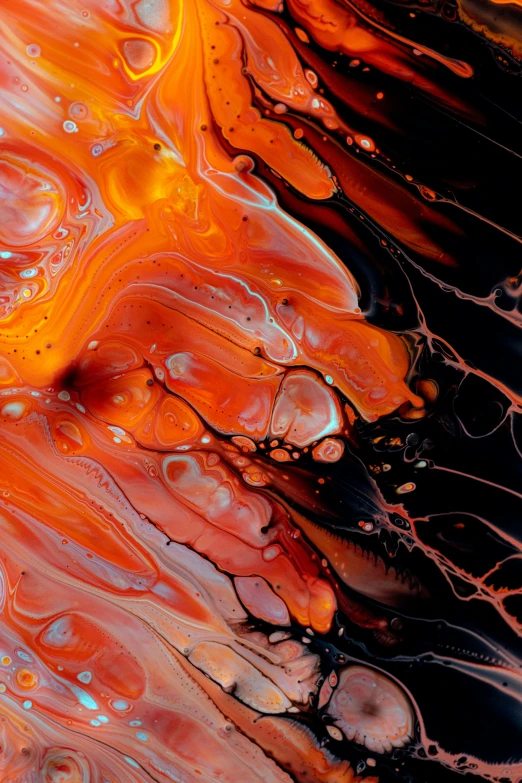 a liquid paint style background with lots of orange and red colors