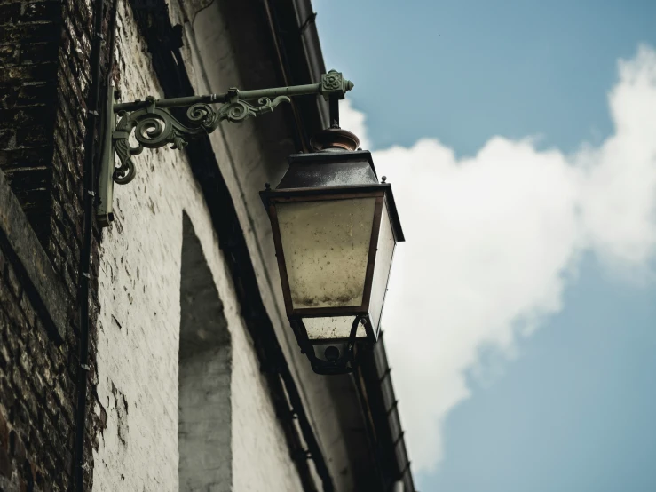 a street light on the side of a building