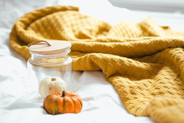 a table with three pumpkins sitting on top of it