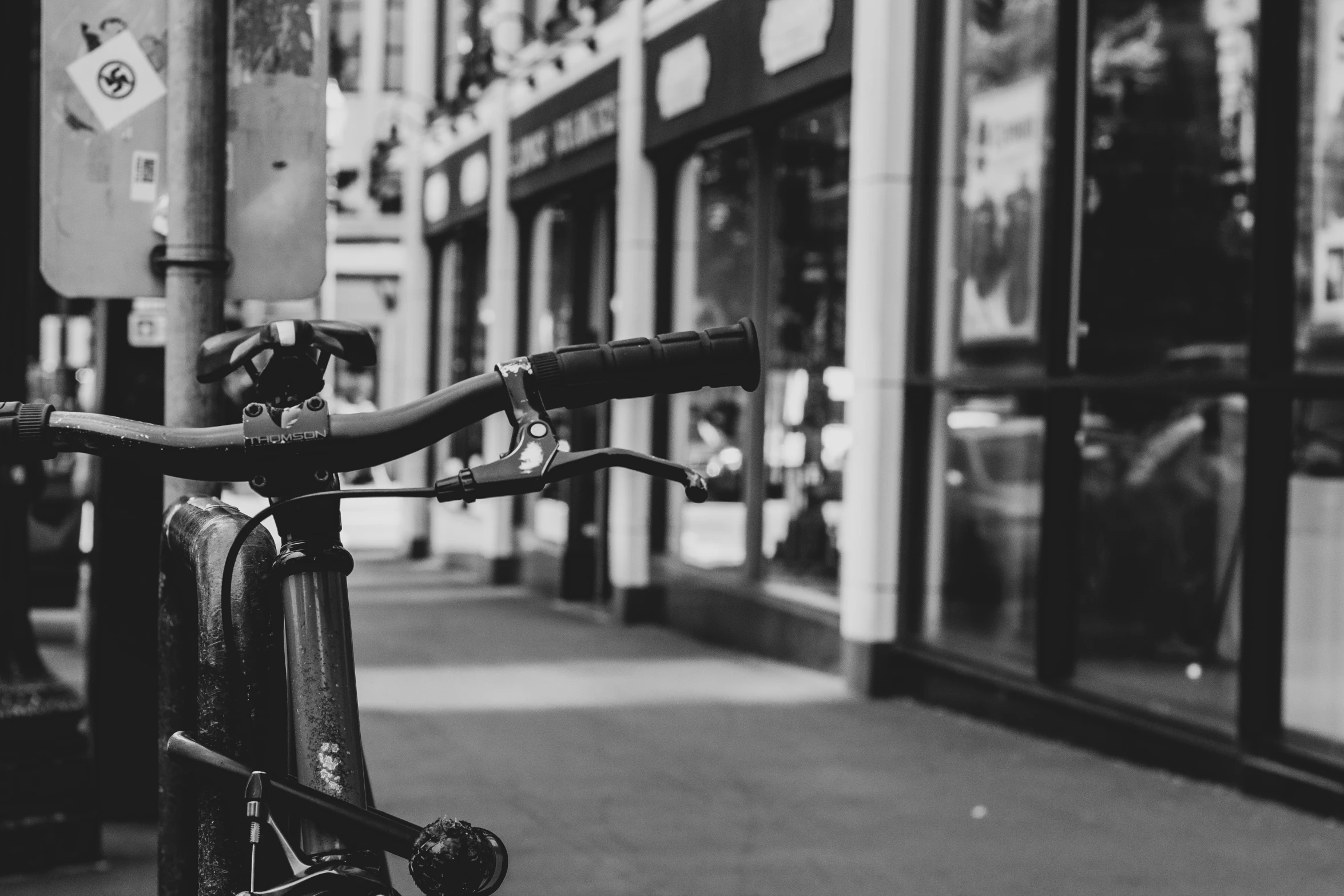 a bicycle sitting on a city street next to some building