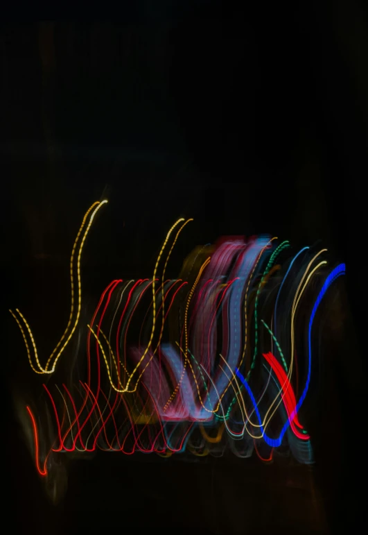 an image of light streaks from cars on the road